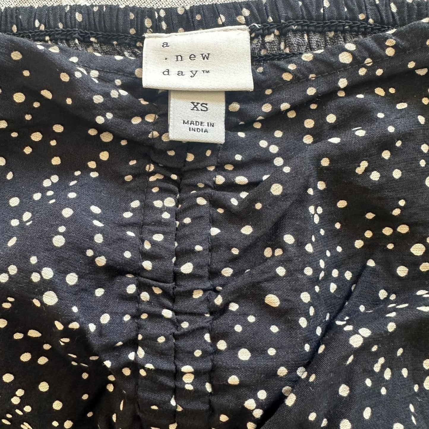 A new day black polka