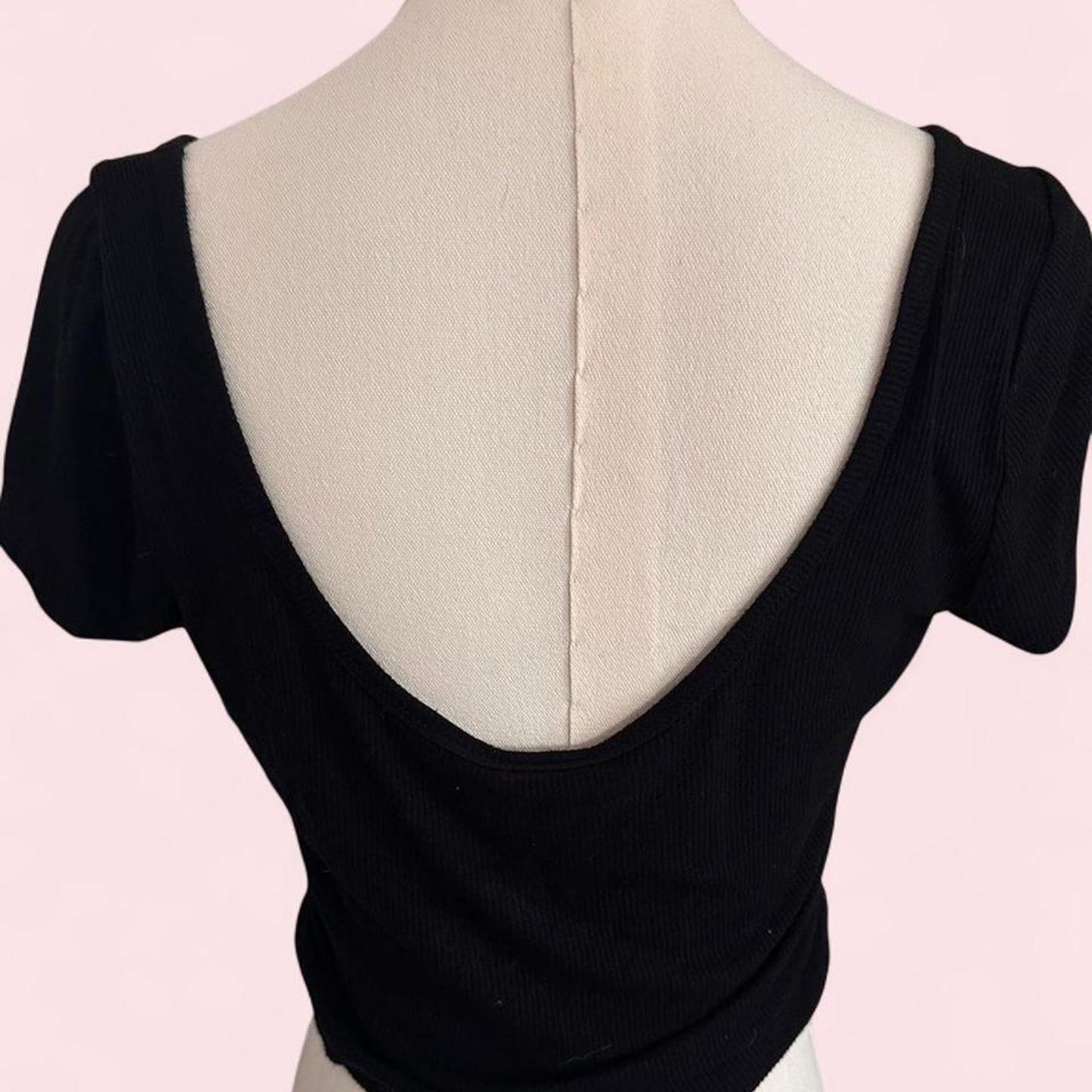 black crop top with scoop neck and short sleeves