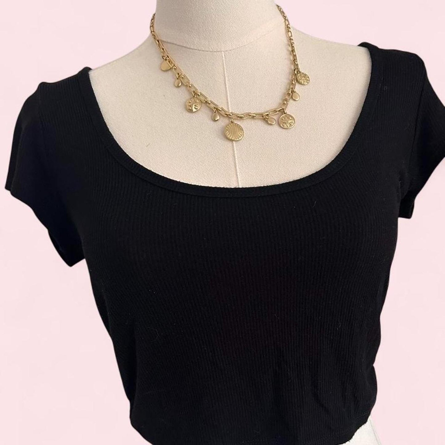 black crop top with scoop neck and short sleeves